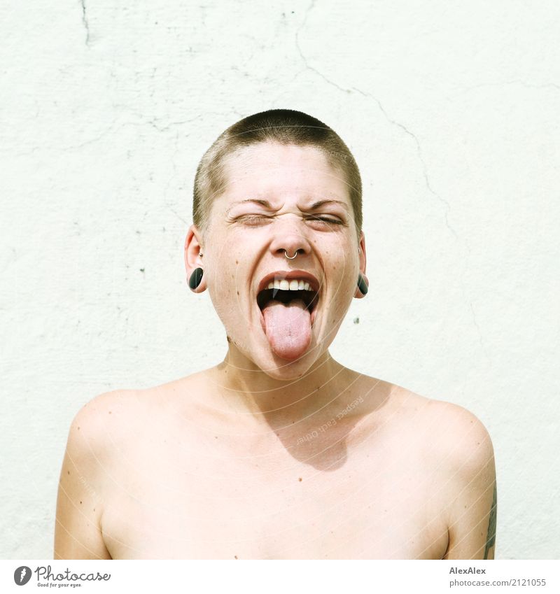 Young woman with short hair sticks out her tongue Lifestyle Style already Youth (Young adults) Face Tongue 18 - 30 years Adults Youth culture Subculture