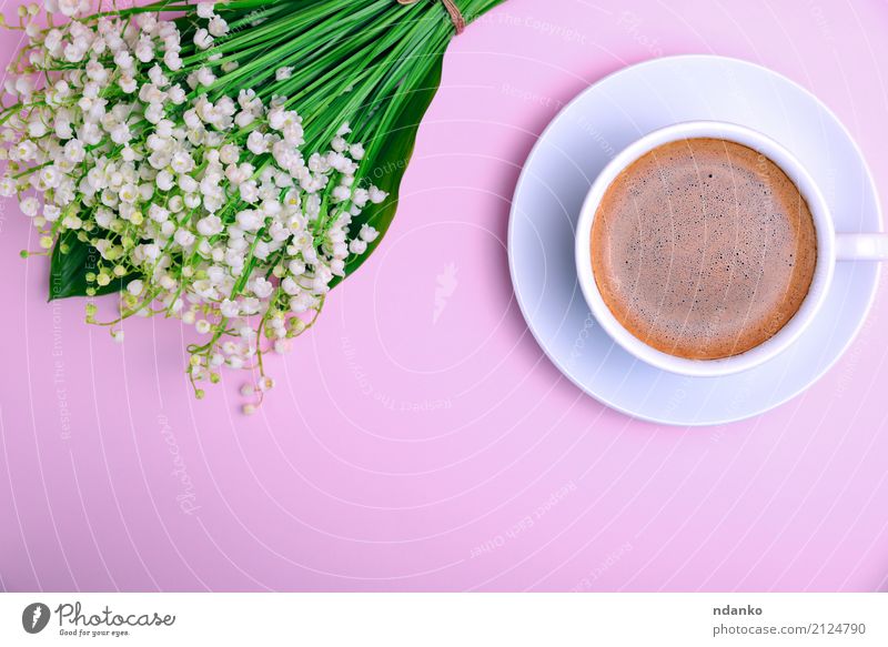 cup of coffee with foam Breakfast To have a coffee Beverage Coffee Espresso Cup Mug Table Restaurant Flower Bouquet Blossoming Fresh Above Pink Black White