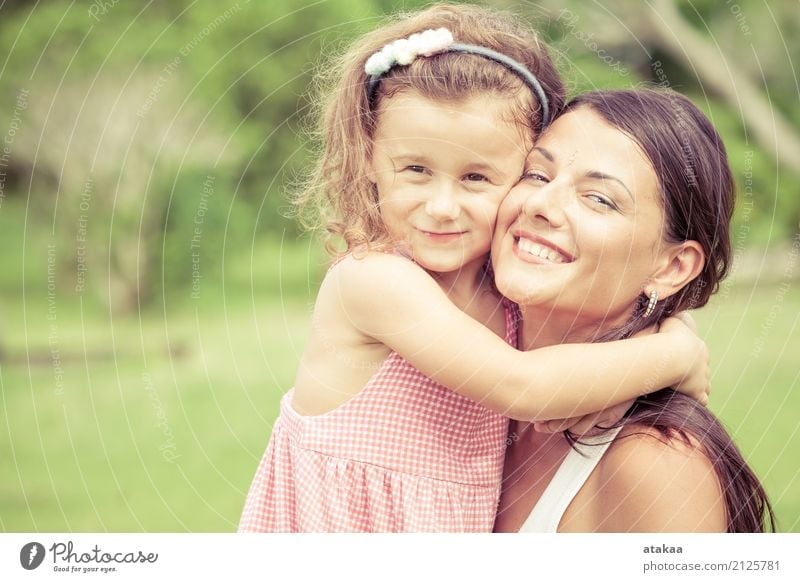 Happy mother and daughter playing in the park at the day time. Concept of celebration Mothers day . Lifestyle Joy Beautiful Face Leisure and hobbies Playing