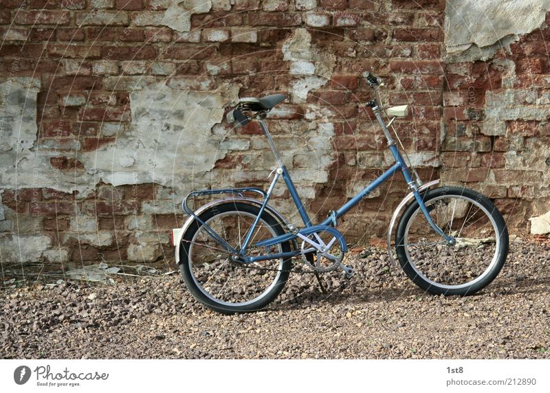 adaptive Means of transport Bicycle Old folded Folding bicycle folding wheel GDR mifa Colour photo Exterior shot Deserted Object photography Product photography