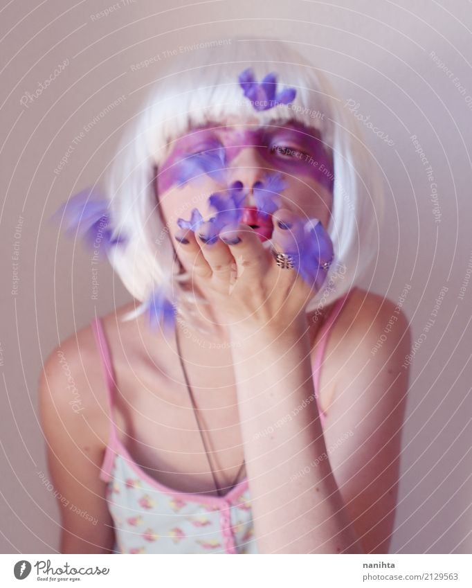 Artistic portrait of a woman blowing purple flowers Exotic Beautiful Make-up Wellness Senses Human being Feminine Young woman Youth (Young adults) 1