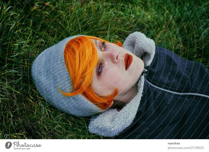 Young redhead woman lying on a field of grass and looking away Beautiful Skin Face Human being Feminine Young woman Youth (Young adults) 1 18 - 30 years Adults