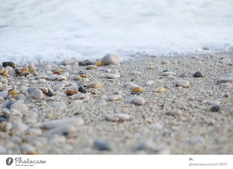 Your little stone in the surf Vacation & Travel Beach Ocean Waves Surf Foam White crest Landscape Water Wind Coast Mediterranean sea Stone Sand Fluid Wet Clean