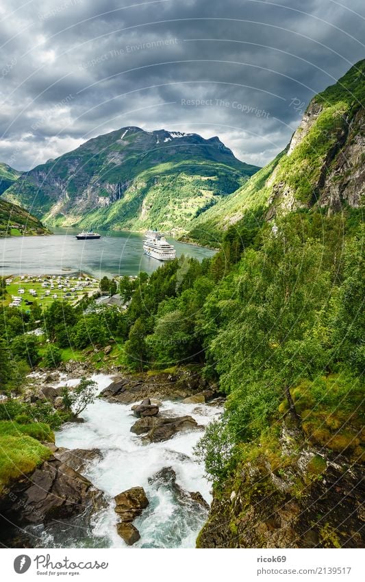 View of the Geirangerfjord in Norway Relaxation Vacation & Travel Tourism Cruise Mountain Nature Landscape Water Clouds Rock Fjord River Tourist Attraction