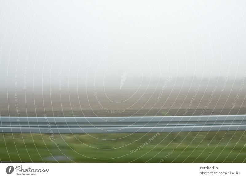 fog Landscape Field Road traffic Motoring Driving Crash barrier Fog Haze Dreary Bright steamy Perspective Speed on the way home Colour photo Subdued colour