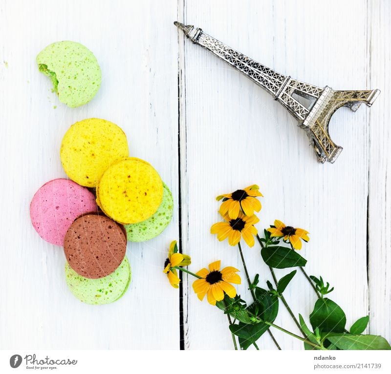 Multi-colored pastries macarons Dessert Candy Gastronomy Flower Bright Delicious Brown Yellow Green Pink White Tradition colorful background Macaron sweet cake