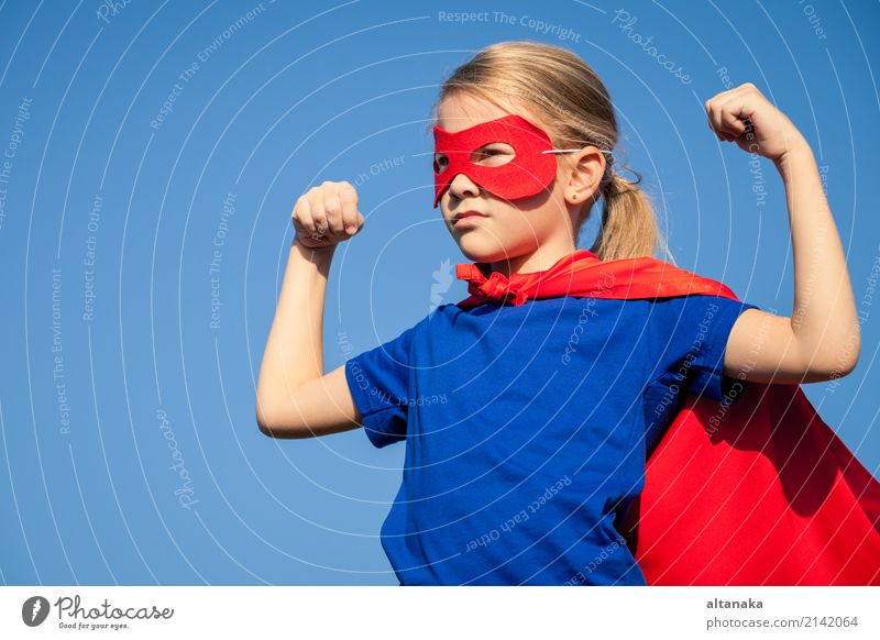 Happy little child playing superhero. Kid having fun outdoors. Concept of girl power. Lifestyle Joy Beautiful Playing Vacation & Travel Adventure Freedom Summer