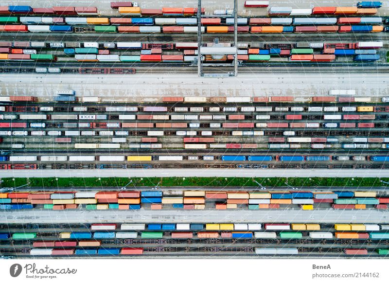 Freight trains and freight containers in a container terminal Workplace Economy Industry Trade Logistics Business Machinery Technology crane Transport