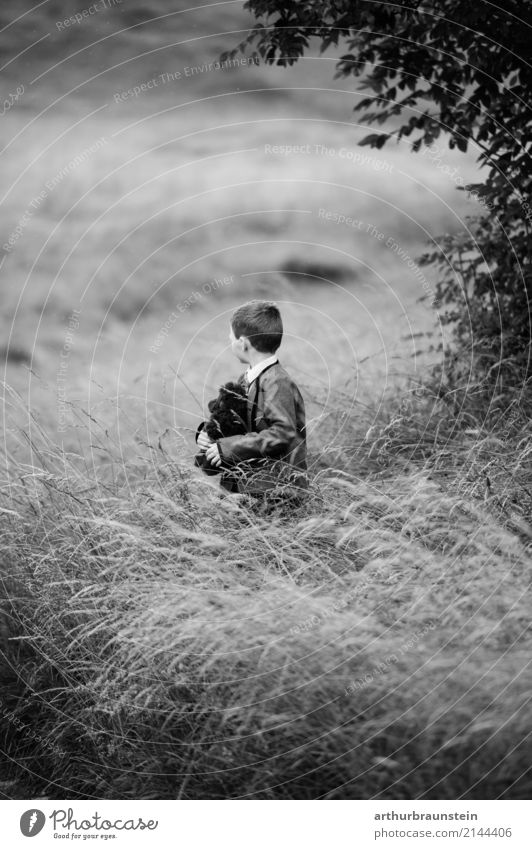 Boy with teddy bear in high grass Leisure and hobbies Children's game Trip Human being Masculine Boy (child) Brother Family & Relations Infancy Life 1