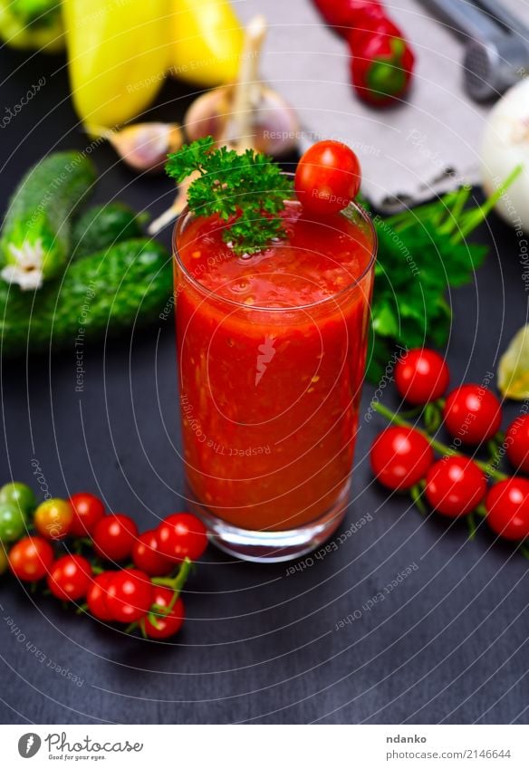 Freshly made juice from red tomato Vegetable Herbs and spices Vegetarian diet Diet Juice Glass Kitchen Wood Green Red Black Tomato Cherry pepper background