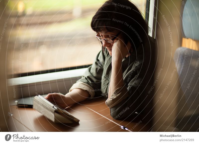 Woman on Train Reads on Table Computer Vacation & Travel PDA Human being Feminine Adults 1 Transport Means of transport Train travel Reading Sit Tablet computer