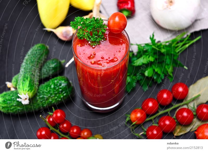 glass of freshly squeezed tomato juice Vegetable Herbs and spices Vegetarian diet Diet Cold drink Juice Glass Kitchen Wood Fresh Above Green Red Black Tomato