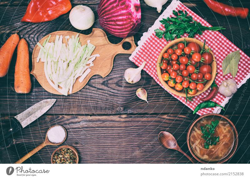 Plate with borscht and food for cooking Vegetable Soup Stew Herbs and spices Nutrition Lunch Dinner Vegetarian diet Bowl Knives Spoon Kitchen Wood Eating Fresh