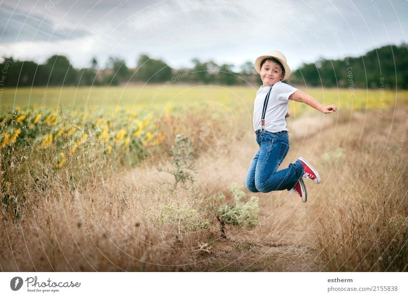 Smiling boy jumping in the field Lifestyle Joy Leisure and hobbies Children's game Vacation & Travel Trip Adventure Freedom Summer Human being Masculine Toddler