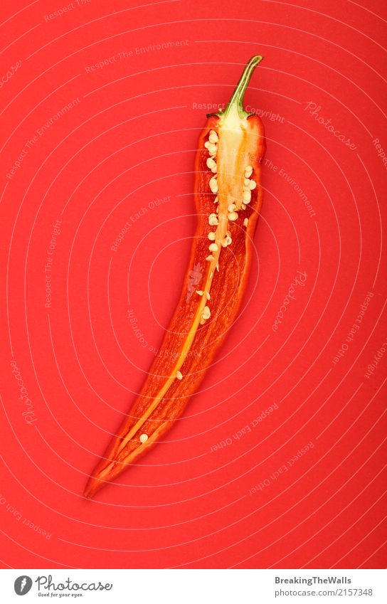 Half of hot chili pepper over red paper background Food Vegetable Nutrition Organic produce Vegetarian diet Diet Healthy Eating Aggression Hot Delicious Natural