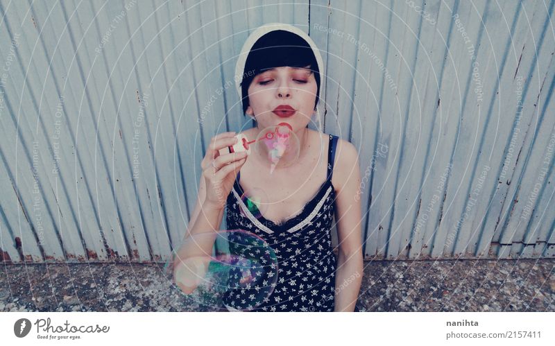 Young woman playing with soap bubbles Lifestyle Wellness Relaxation Leisure and hobbies Playing Human being Feminine Youth (Young adults) 1 18 - 30 years Adults