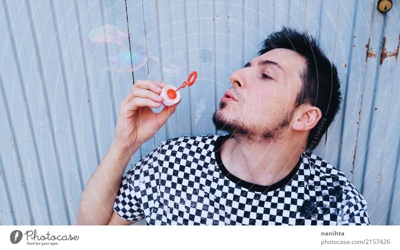 Young man playing with soap bubbles Lifestyle Style Wellness Relaxation Leisure and hobbies Playing Human being Masculine Youth (Young adults) 1 18 - 30 years