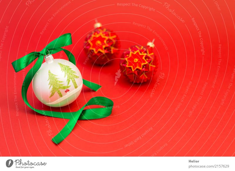 Christmas balls with green ribbon on red background Design Joy Feasts & Celebrations Christmas & Advent Ornament Sphere String Bow Green Red White Emotions