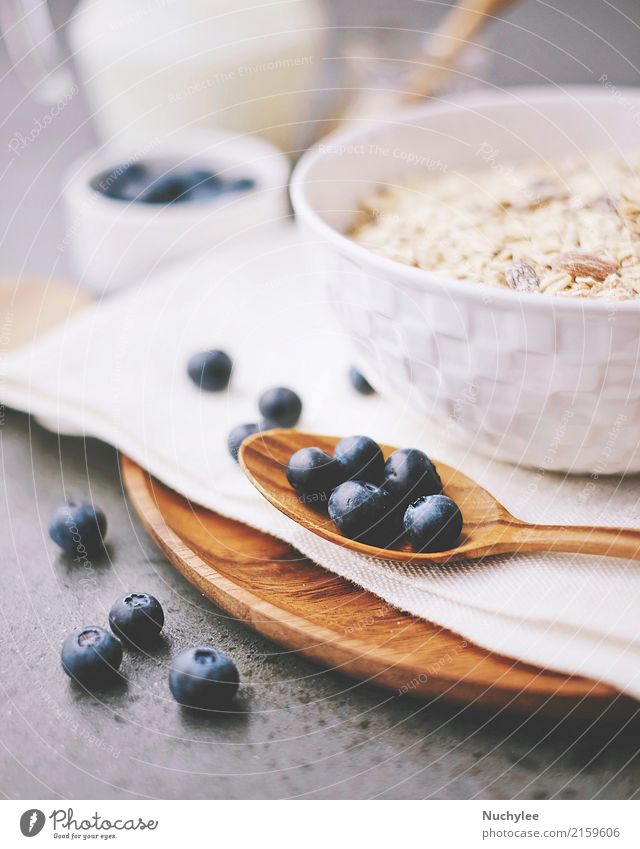 organic fresh blueberry and cereal with milk Fruit Nutrition Breakfast Organic produce Diet Bowl Spoon Healthy Eating Paper Wood Fresh Delicious Natural White