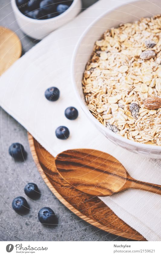 organic fresh blueberry and cereal Fruit Nutrition Breakfast Organic produce Diet Bowl Spoon Healthy Eating Paper Wood Fresh Delicious Natural White background