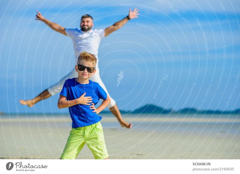 Happy father and son at the tropical beach, laughing and enjoying time together Lifestyle Joy Playing Summer Ocean Island Infancy Landscape Sunglasses Beard