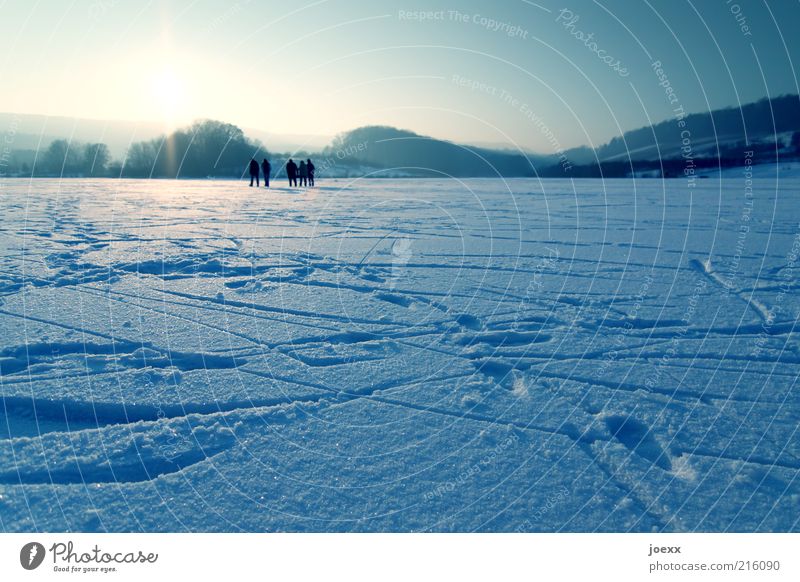 ice skating Winter Snow Winter vacation Human being Group Nature Sky Sunrise Sunset Sunlight Beautiful weather Ice Frost Field Hill Lake Relaxation Going