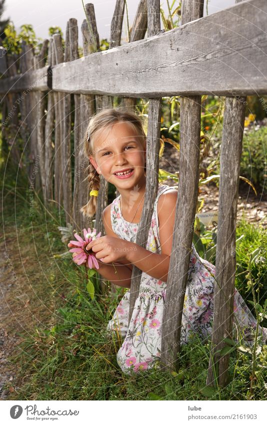 flower girl Valentine's Day Gardening Girl Infancy Environment Nature Landscape Plant Park Meadow Happy Happiness Contentment flower garden Fence Child