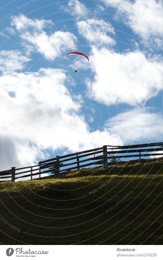 Freedom! Mountain Sports Flying Parachute Paragliding Human being 1 Environment Nature Landscape Sky Clouds Grass Hill Fantastic Blue Colour photo Exterior shot