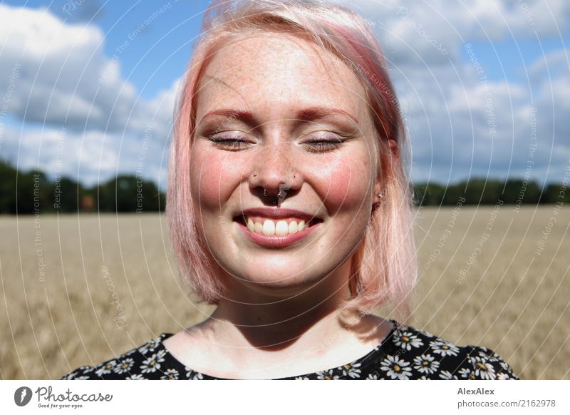 Portrait of a smiling young woman with freckles standing in front of a field Joy luck already Face Contentment Trip Summer Young woman Youth (Young adults)