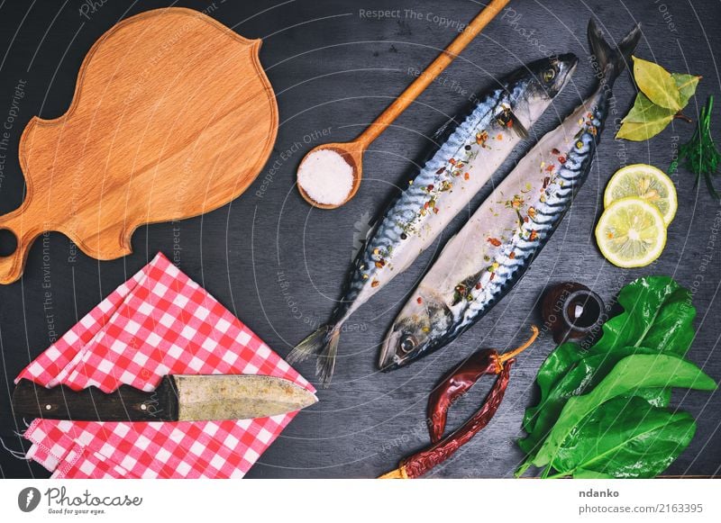 fresh mackerel fish with spices Fish Seafood Herbs and spices Nutrition Lunch Dinner Diet Knives Spoon Table Restaurant Gastronomy Nature Animal Wood Fresh