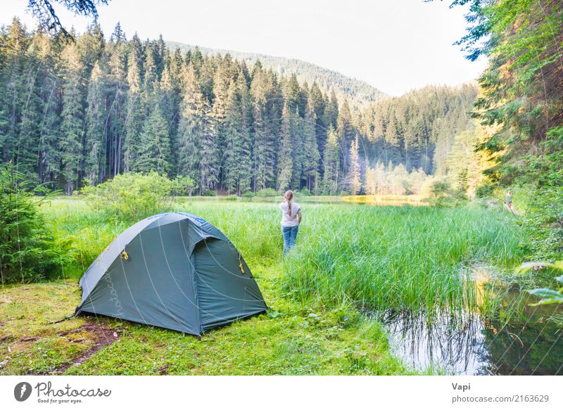 Young woman near green tent and forest lake Lifestyle Beautiful Healthy Health care Fitness Wellness Harmonious Well-being Relaxation Meditation