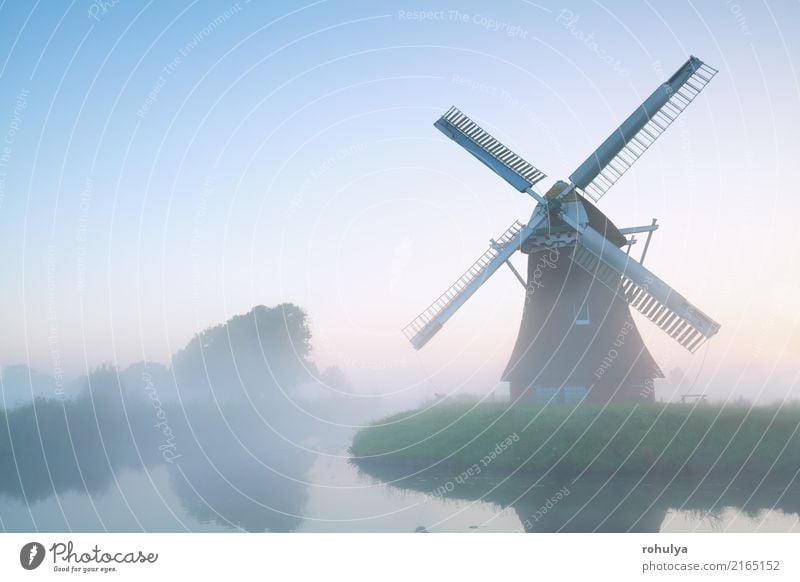 charming windmill in morning fog, Holland Vacation & Travel Culture Nature Landscape Sky Summer Beautiful weather Fog Pond Lake Building Architecture