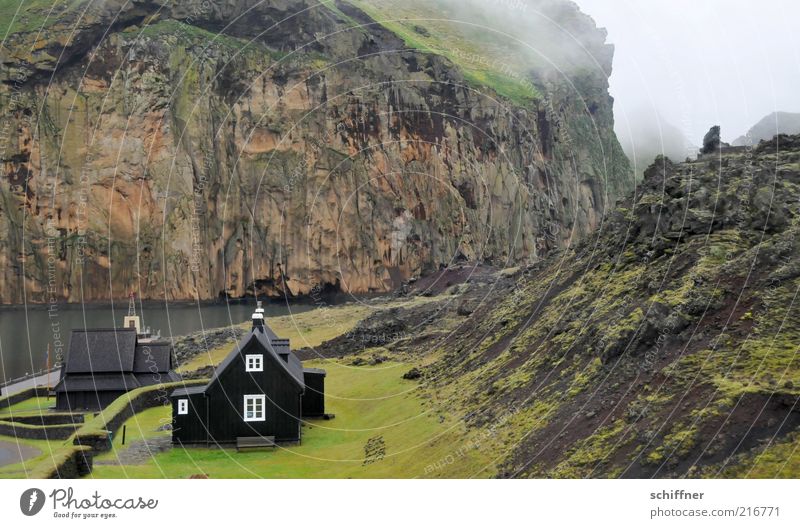 Heimaey - home ey! Bad weather Hill Rock Volcano Canyon Coast Bay Fjord Dark Small Church Stave church Remote Nordic Iceland Island Loneliness Meadow