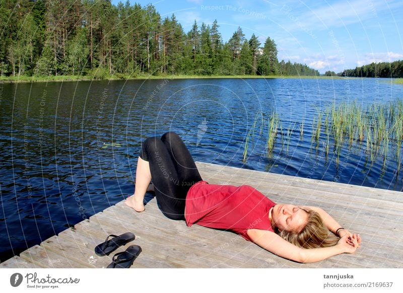 Young woman relaxing near lake in Karelia, Finland Lifestyle Beautiful Relaxation Vacation & Travel Tourism Camping Summer Woman Adults 1 Human being