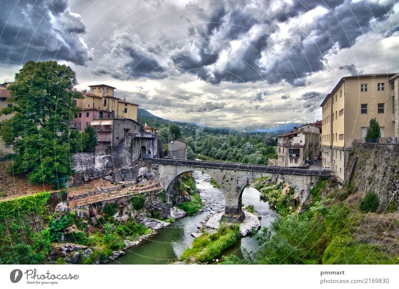 stone bridge of an ancient village under cloudy sky Vacation & Travel Tourism Mountain House (Residential Structure) Culture Nature Landscape Sky Weather Storm