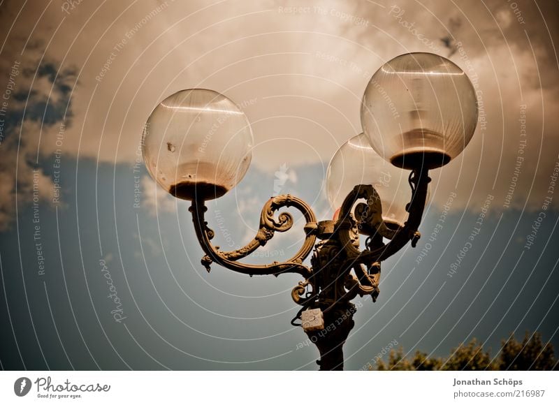 I go with my lantern Narbonne France Europe Old town Esthetic Historic Above Blue Brown Elegant South 3 Lamp Illuminate Ornate Sky Metal Bright Rustic Broken