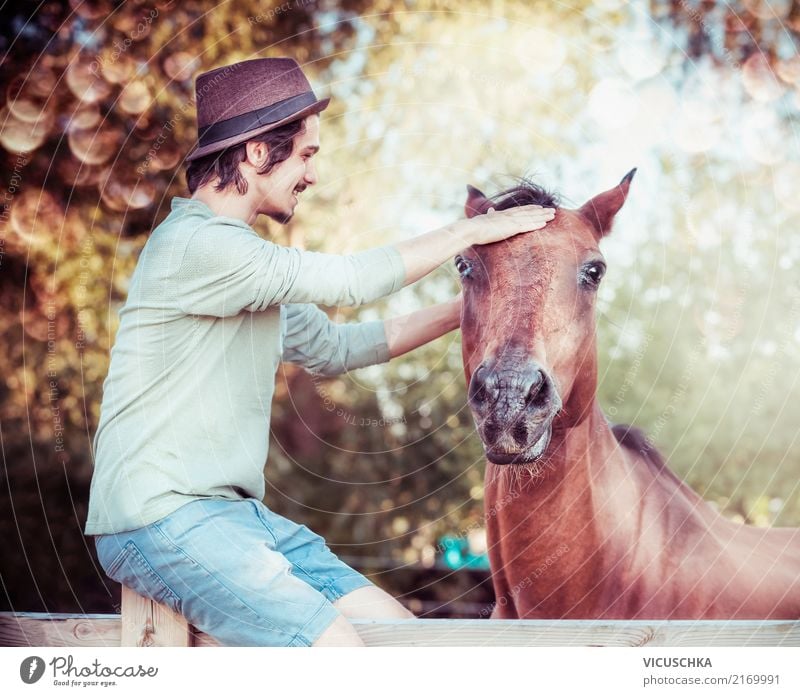 Communication between man and horse Lifestyle Human being Masculine Young man Youth (Young adults) Nature Autumn Beautiful weather Animal Horse Emotions Moody