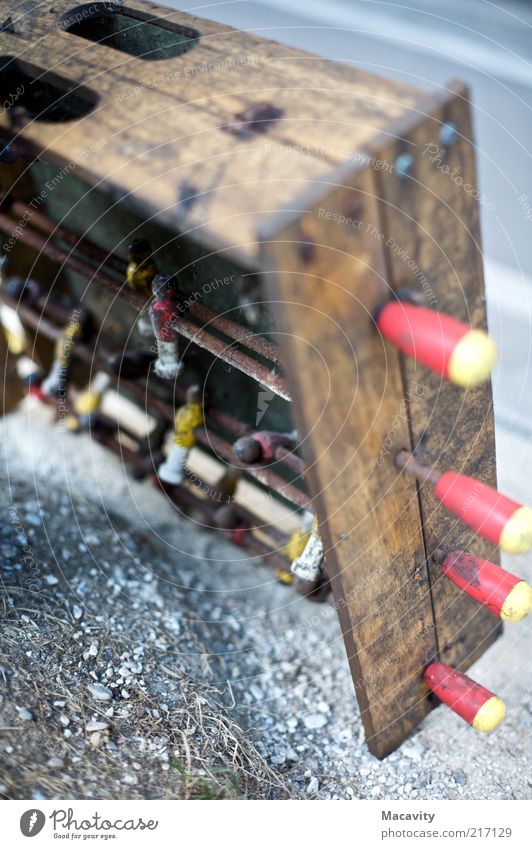 vertical kicker Leisure and hobbies Table soccer Collector's item Wood Dirty Broken Transience Colour photo Subdued colour Exterior shot Close-up Detail