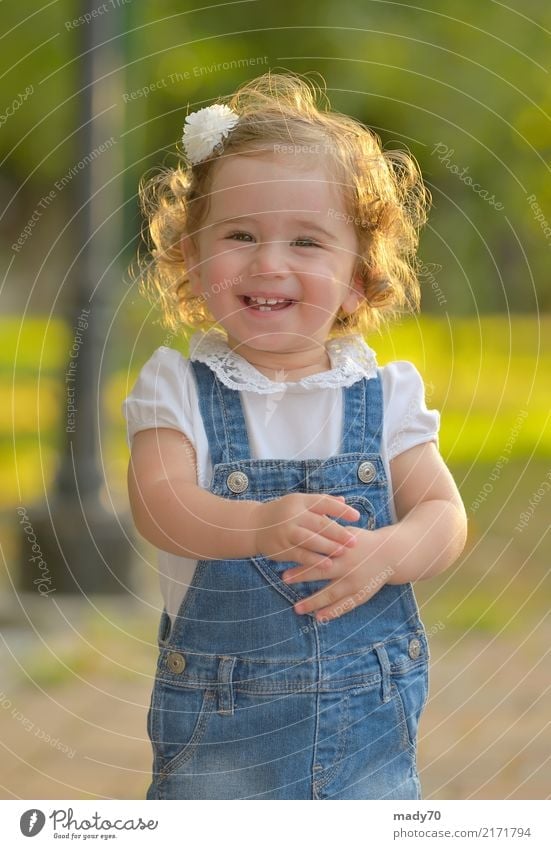 Little girl smiling against the sun Joy Happy Face Life Sun Child Toddler Woman Adults Infancy Park Smiling Happiness Small Natural Cute Innocent Girl Isolated