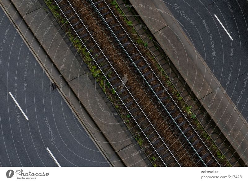 off Deserted Traffic infrastructure Public transit Road traffic Street Brown Gray Pavement Railroad tracks Railroad system Median strip Colour photo