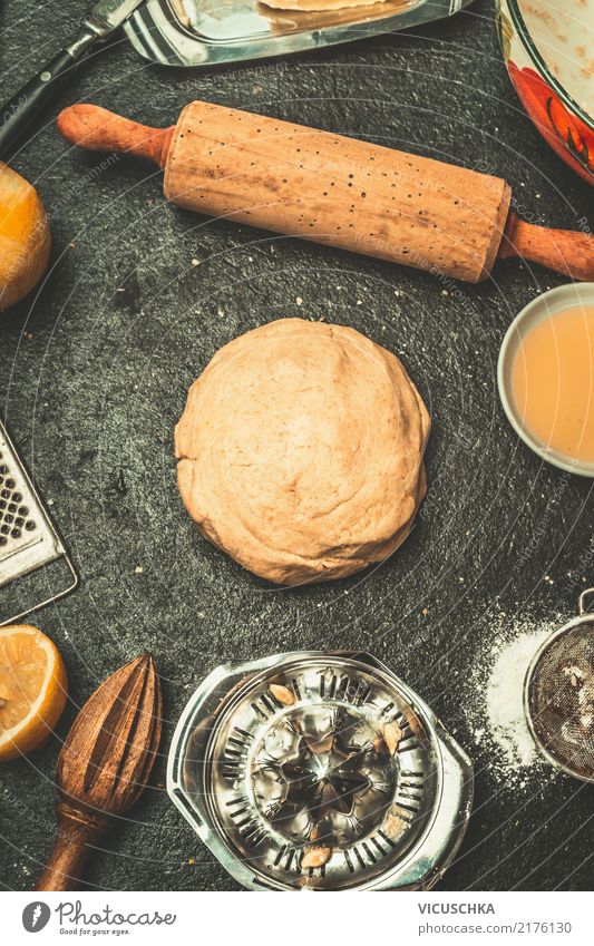 Dough on the kitchen table Food Baked goods Nutrition Crockery Style Design Living or residing Table Kitchen Yellow Baking Rolling pin Kitchen Table Ingredients