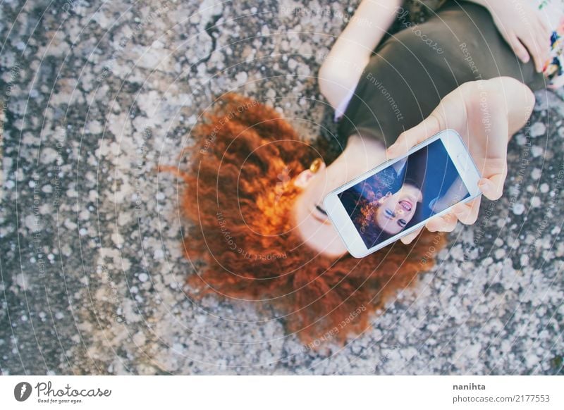 Young redhead woman taking a self-portrait Lifestyle Style Joy Leisure and hobbies Cellphone Screen Camera Entertainment electronics Advancement Future