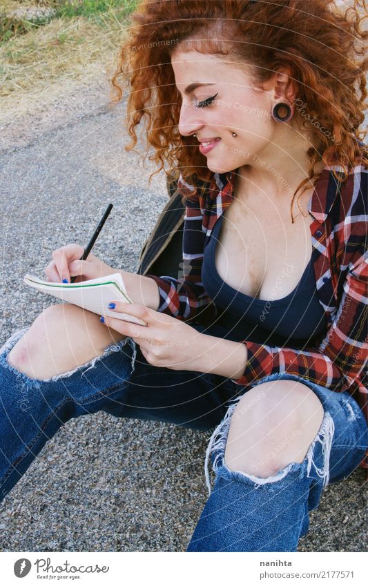 Young redhead woman writing in a notebook Lifestyle Style Beautiful Study Student Human being Feminine Young woman Youth (Young adults) 1 18 - 30 years Adults