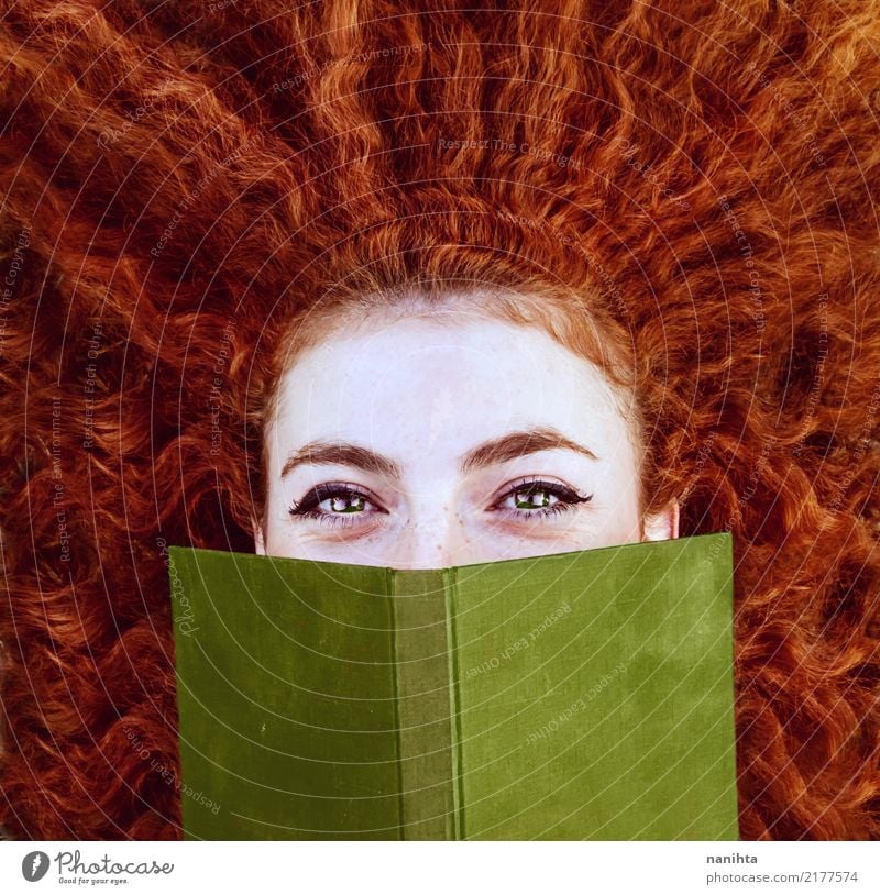 Redhead young woman covering by a red book Lifestyle Beautiful Face Freckles Study Human being Feminine Young woman Youth (Young adults) 1 18 - 30 years Adults