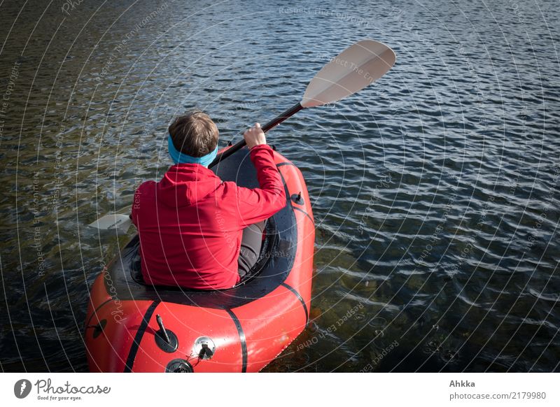 Young man in a red boat on a lake, Norway Adventure Aquatics Education Science & Research Youth (Young adults) 1 Human being Nature Water Spring Summer Lake