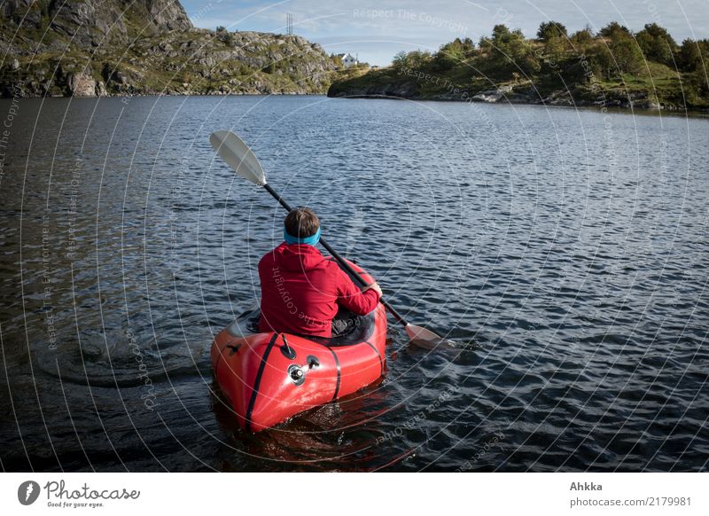 Red paddler on a Norwegian mountain lake Life Vacation & Travel Trip Adventure Far-off places Freedom Aquatics Young man Youth (Young adults) Nature Elements