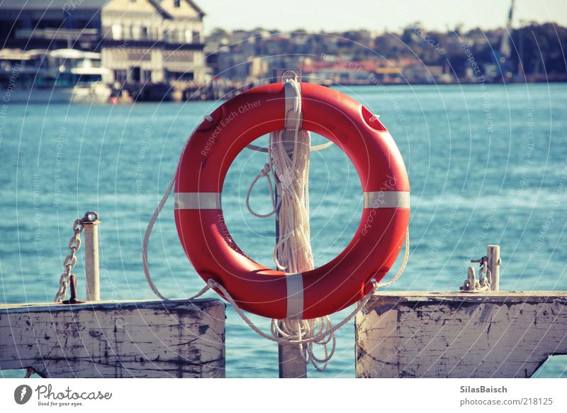 safe is safe Port City Navigation Watercraft Life belt Harbour Rope Circle Safety Colour photo Exterior shot Orange Jetty