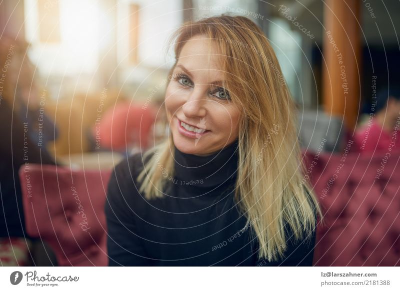 Attractive woman sitting in a restaurant Happy Face Restaurant Business PDA Woman Adults 1 Human being 30 - 45 years Fashion Scarf Blonde Smiling Sit Thin