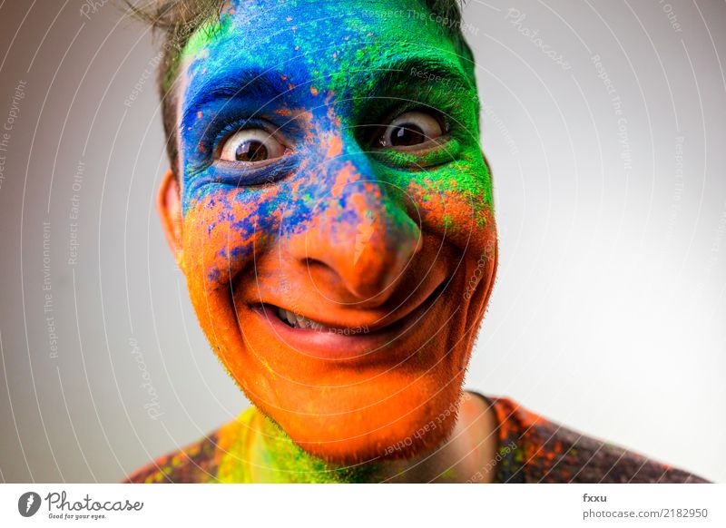 crackers Multicoloured Laughter Smiling Crazy Perspective Holi Kino Powder Man Young man Face Blue Yellow Green Orange Nose Large Looking into the camera