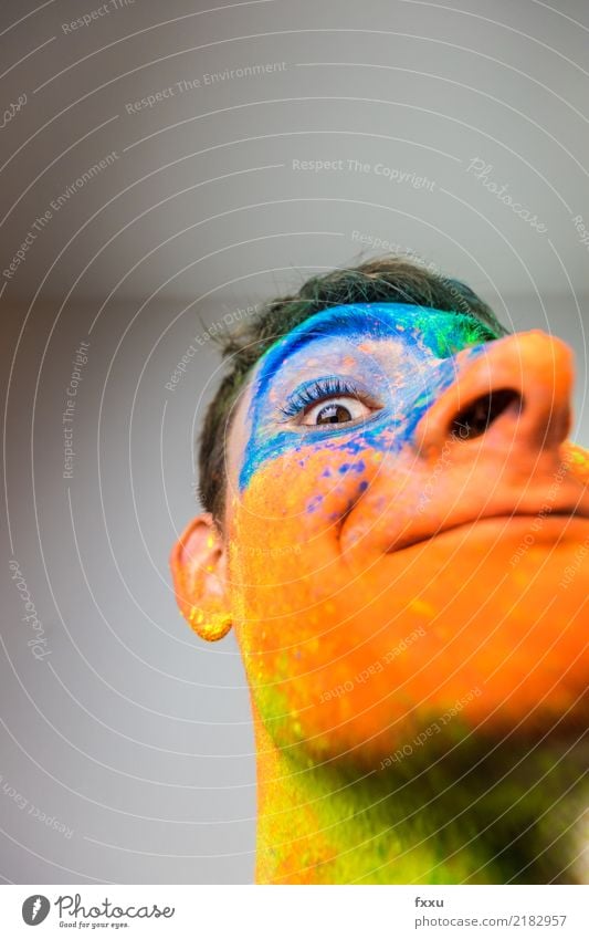 Colourful, painted face Multicoloured Laughter Smiling Crazy Perspective Holi Kino Powder Man Young man Face Blue Yellow Green Orange Nose Large